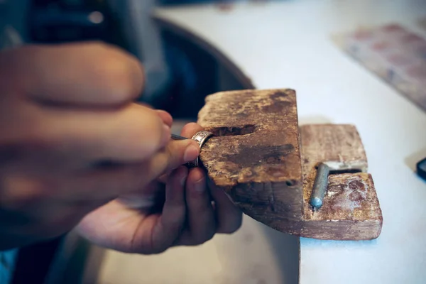 Different goldsmiths tools on the jewelry workplace. Jeweler at work in jewelry.