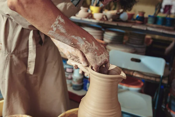 Creating a jar or vase of white clay close-up. Master crock. Man hands making clay jug macro. — Stock Photo, Image