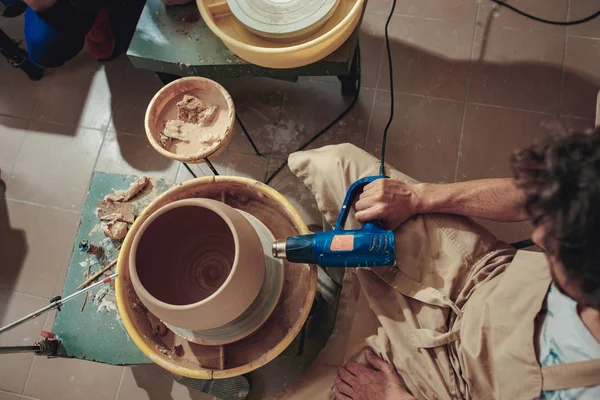 Creating a jar or vase of white clay close-up. Master crock. Man hands making clay jug macro. — Stock Photo, Image