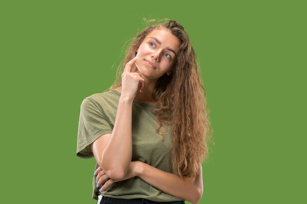 Young serious thoughtful woman. Doubt concept.