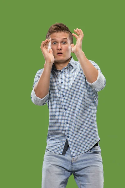 Portrait of the scared man on green — Stock Photo, Image