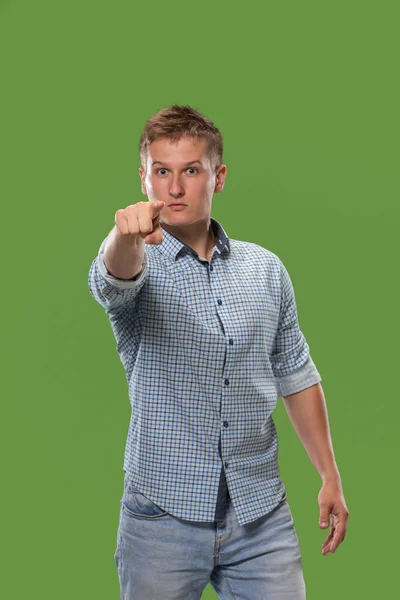 The overbearing businessman point you and want you, half length closeup portrait on green background.