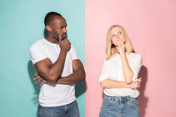 Young serious thoughtful businessman and woman. Doubt concept. — Stock Photo, Image