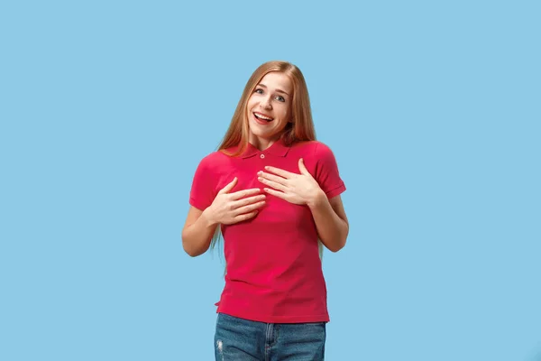 The happy business woman standing and smiling against blue background. — Stock Photo, Image