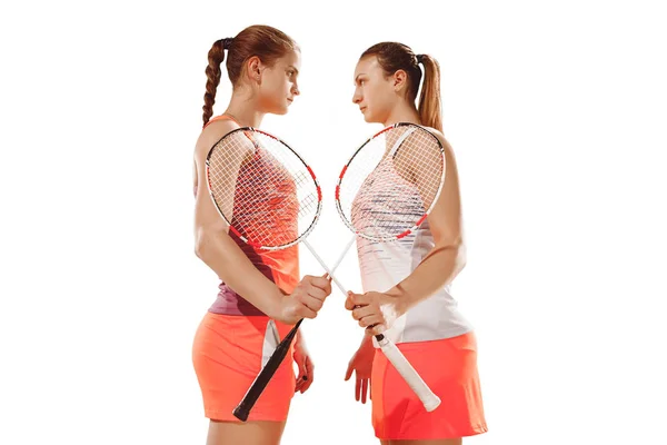Young women badminton players posing over white background — Stock Photo, Image