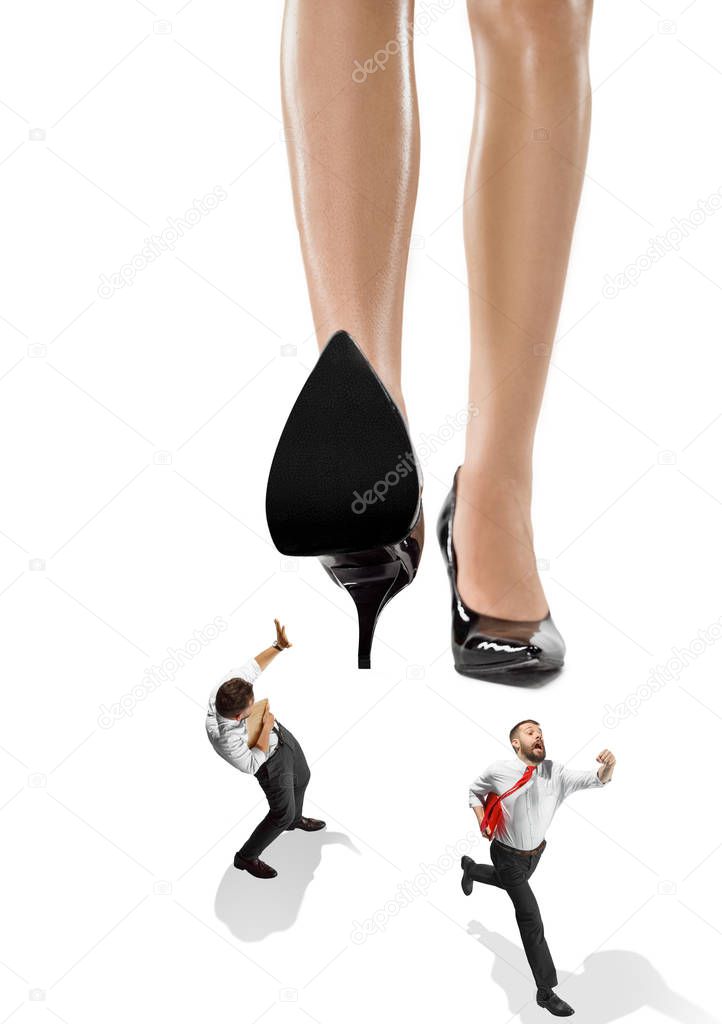 The conceptual collage about lady boss and small men under big female heel.