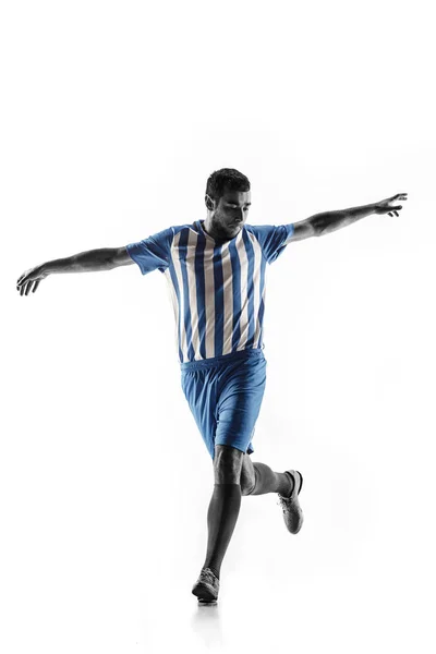 Futebol profissional jogador de futebol em ação isolado no fundo branco — Fotografia de Stock