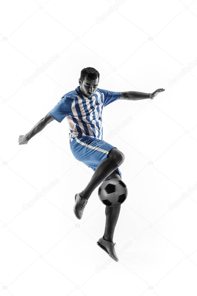 Professional football soccer player with ball isolated on white background