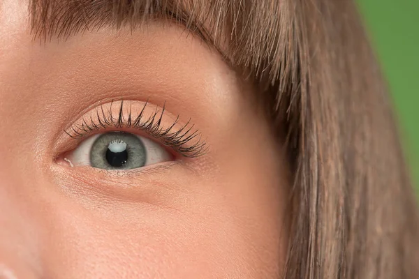 The close up eye on face of young beautiful caucasian girl — Stock Photo, Image