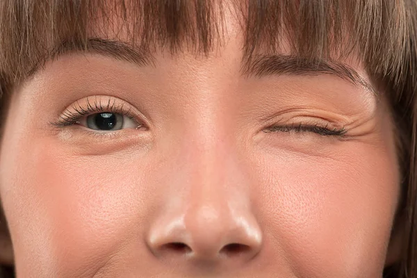 The close up eyes on face of young beautiful caucasian girl — Stock Photo, Image