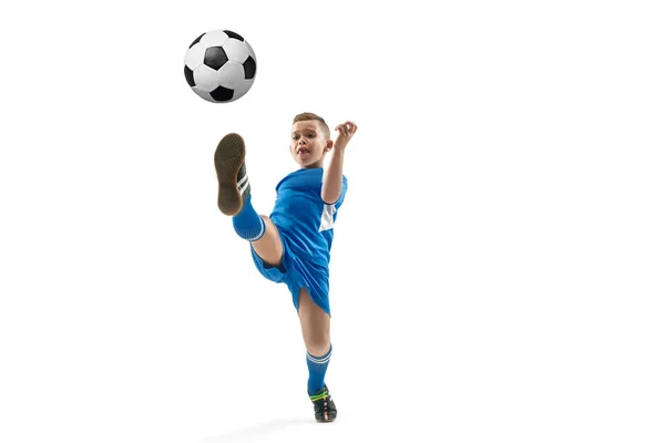 Young boy with soccer ball doing flying kick — Stock Photo, Image