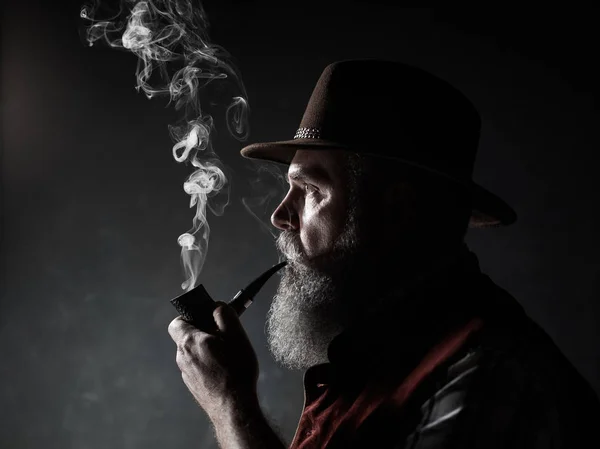 Dramatic Portrait Senior Man Hat Smoking Tobacco Pipe Profile View — Stock Photo, Image