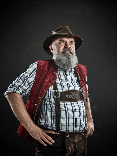 Germany, Bavaria, Upper Bavaria, man with beer dressed in in traditional Austrian or Bavarian costume — Stock Photo, Image