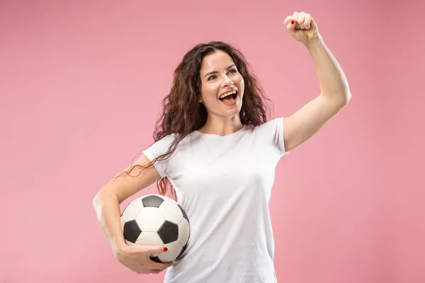 Fan sport woman player holding soccer ball isolated on pink background — Stock Photo, Image