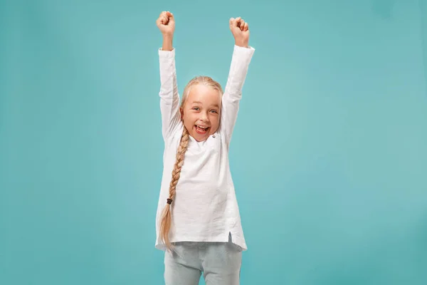 Happy success teen girl celebrating being a winner. Dynamic energetic image of female model — Stock Photo, Image