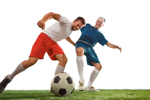 Football players tackling for the ball over white background