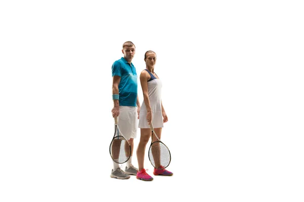 Caucasian man and woman as tennis players posing isolated on white background — Stock Photo, Image