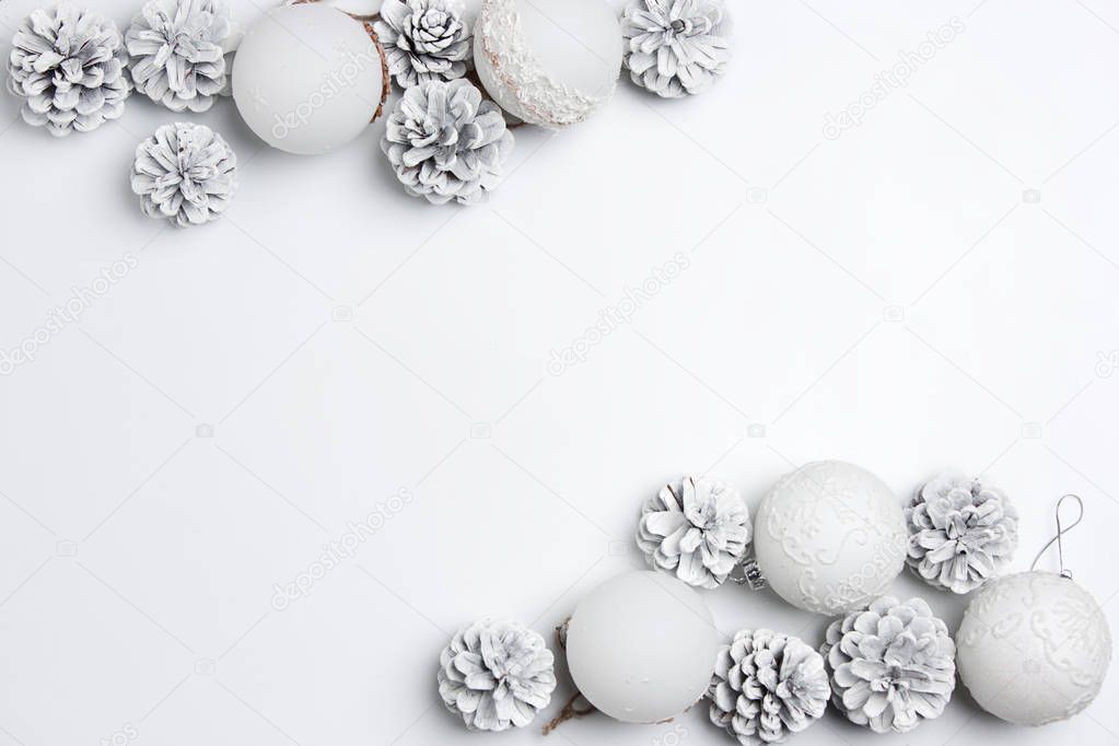 Christmas decorative composition of toys on a white background surrealism. Top view