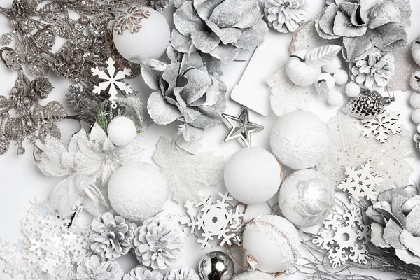 Christmas decorative composition of toys on a white background surrealism. Top view — Stock Photo, Image