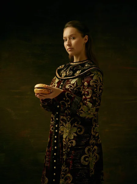 Girl standing in Russian traditional costume.