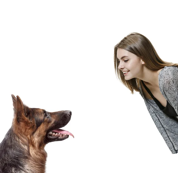 Woman with her dog over white background — Stock Photo, Image