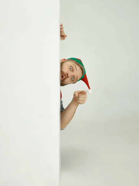 Friendly man dressed like a funny gnome posing on an isolated gray background — Stock Photo, Image