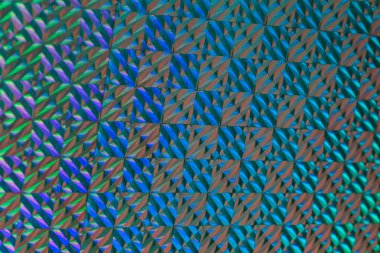 Holografik etkisi ile renkli folyo doku. Noel, yeni yıl, tatil, Festivali, karnaval arka plan