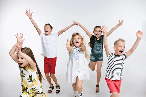stock image Group fashion cute preschooler kids friends posing together and looking at camera white background
