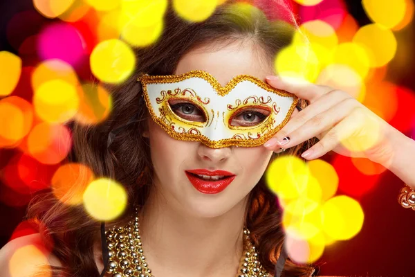 Beauty model woman wearing venetian masquerade carnival mask at party — Stock Photo, Image