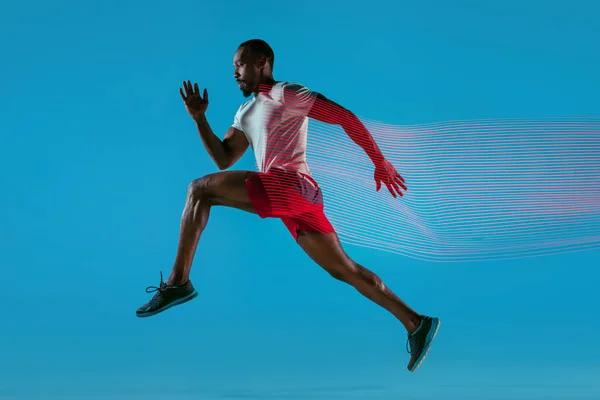 Full length portrait of active young muscular running man,