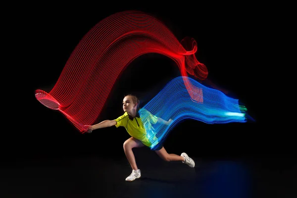 One caucasian young teenager girl woman playing Badminton player on black background — Stock Photo, Image