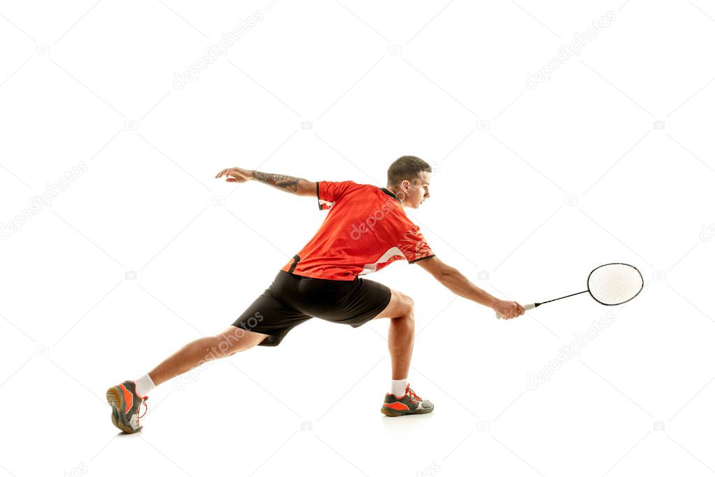 Young male badminton player over white background