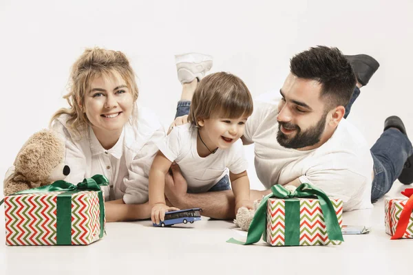 Happy family with kid together and smiling at camera isolated on white — Stock Photo, Image