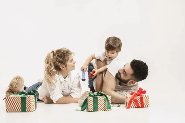 Happy family with kid together and smiling at camera isolated on white — Stock Photo, Image