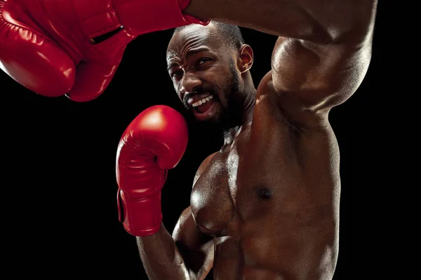 Hand of boxer over black background. Strength, attack and motion concept — Stock Photo, Image