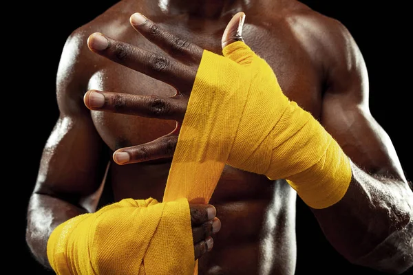 Afro American boxer is wrapping hands with bandage — Stock Photo, Image
