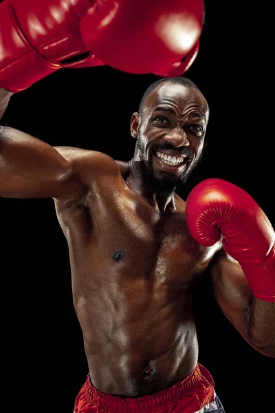 Hand of boxer over black background. Strength, attack and motion concept — Stock Photo, Image