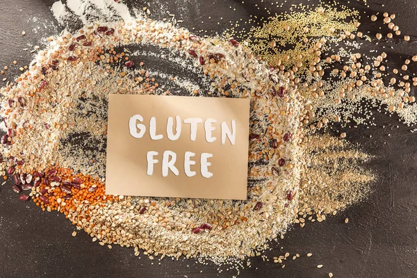 Gluten free flour and cereals millet, quinoa, corn bread, brown buckwheat, rice with text gluten free