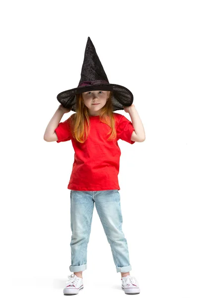 Full length portrait of cute little kid in stylish jeans clothes looking at camera and smiling — Stock Photo, Image