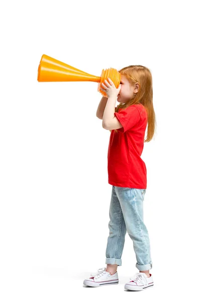 Full length portrait of cute little kid in stylish jeans clothes looking at toy binoculars — Stock Photo, Image