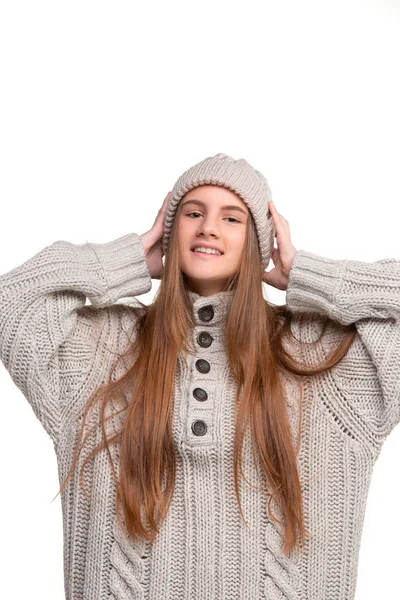 Portrait of cute little kid in stylish knitted sweater looking at camera and smiling — Stock Photo, Image