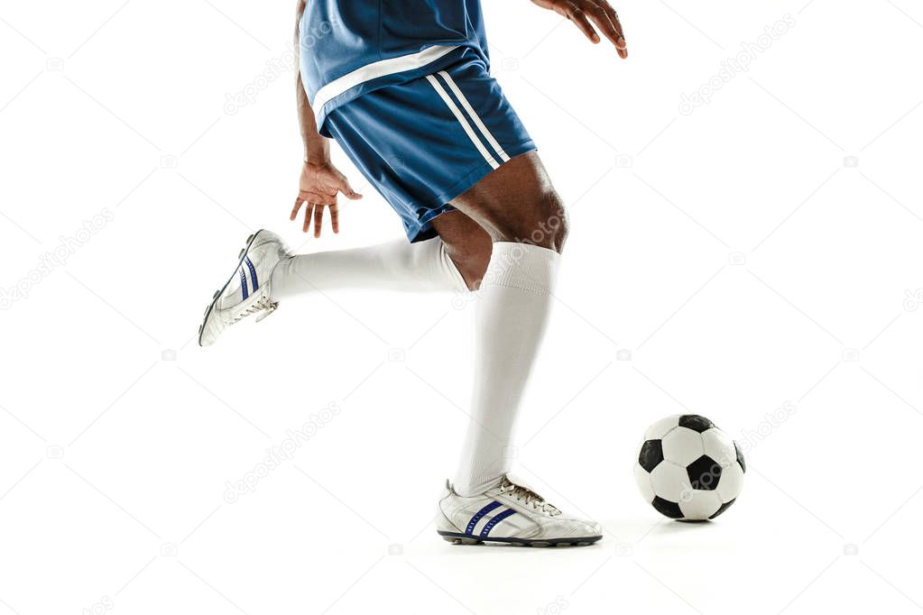 legs of soccer player close-up isolated on white