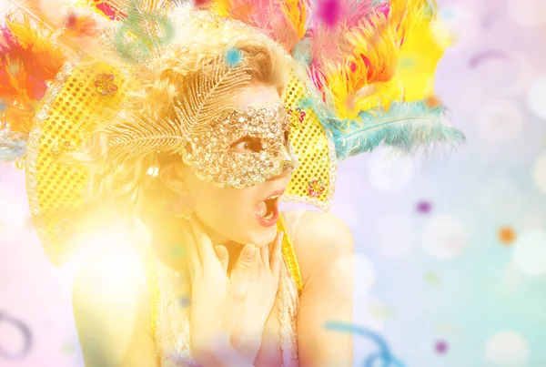 Beautiful young woman in carnival mask Stock Image
