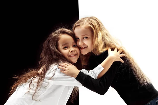 Portrait Two Hugging Embracing Happy Girls White Black Studio Background — Stock fotografie