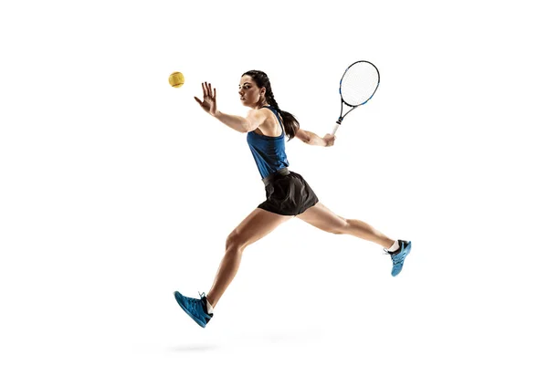 Full length portrait of young woman playing tennis isolated on white background — Stock Photo, Image