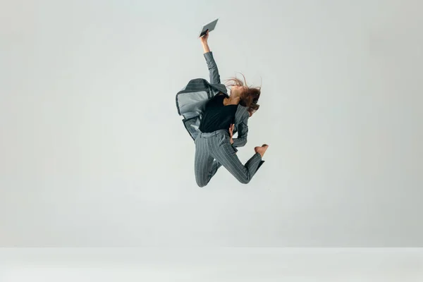 Happy business woman dancing and smiling isolated over white. — Stock Photo, Image