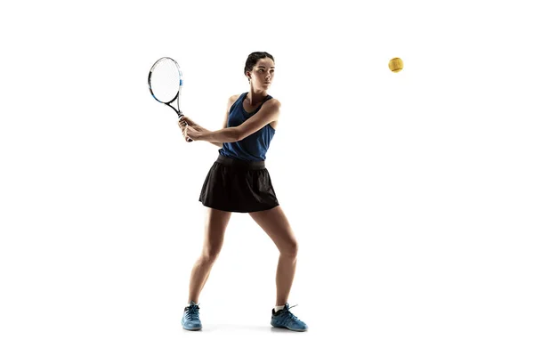 Full length portrait of young woman playing tennis isolated on white background — Stock Photo, Image
