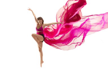 Ballerina. Young graceful female ballet dancer dancing over white studio. Beauty of classic ballet.