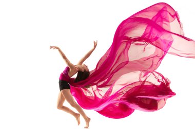 Ballerina. Young graceful female ballet dancer dancing over white studio. Beauty of classic ballet.