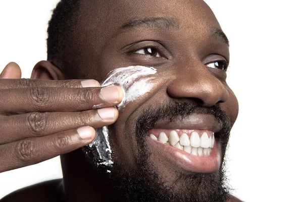 Young African American Guy Applying Face Cream His Eyes White — 스톡 사진